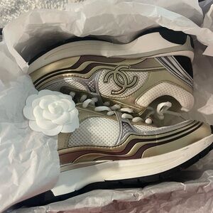 CHANEL Women's Sneakers in Gold and White